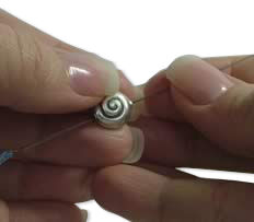 Threading needle through a bead